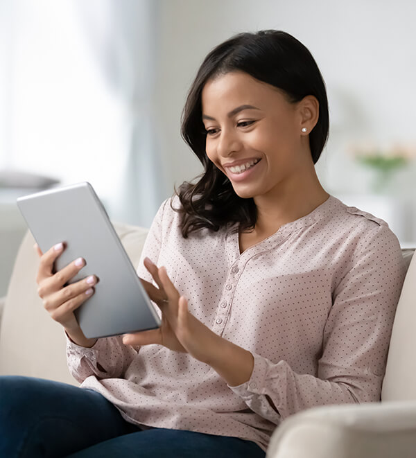woman looking at tablet