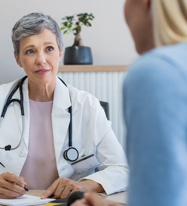 obstetrician gynecologist talking to patient