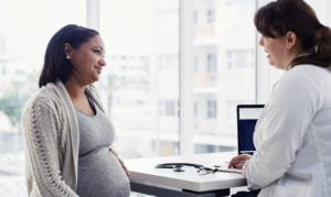 A woman receiving prenatal care from her OB/GYN.