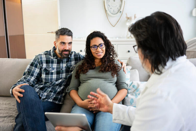 Expecting parents talking to their obgyn doctor