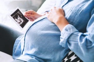 A woman at prenatal care for High-Risk Pregnancy treatment